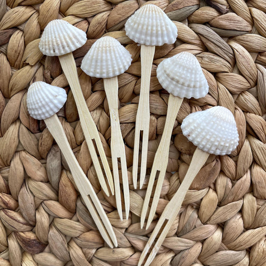 Shell appetizer forks styled on a charcuterie board