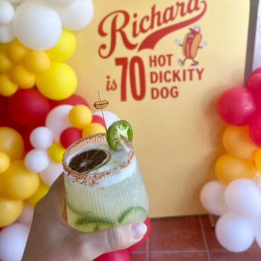 Hot dog picks garnishing a cookout drink