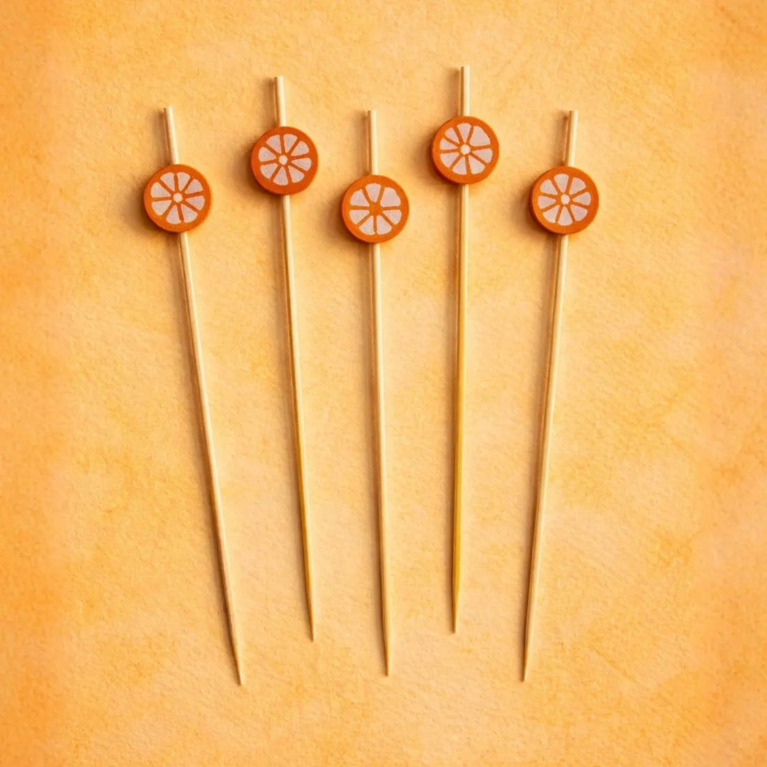 Orange cocktail picks for an old fashioned garnish